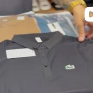 Polo cinza fotografada na RR STORE